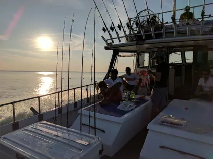 Customers enjoy the cruise to the fishing grounds on the Hot Pursuit